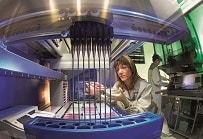 A scientist analyzes tumor markers