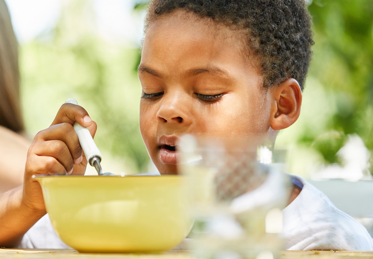 young African boy having breakfast