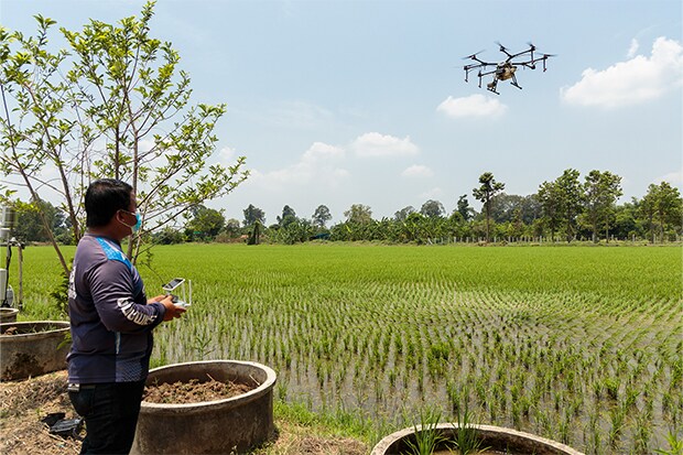 man controlling drone