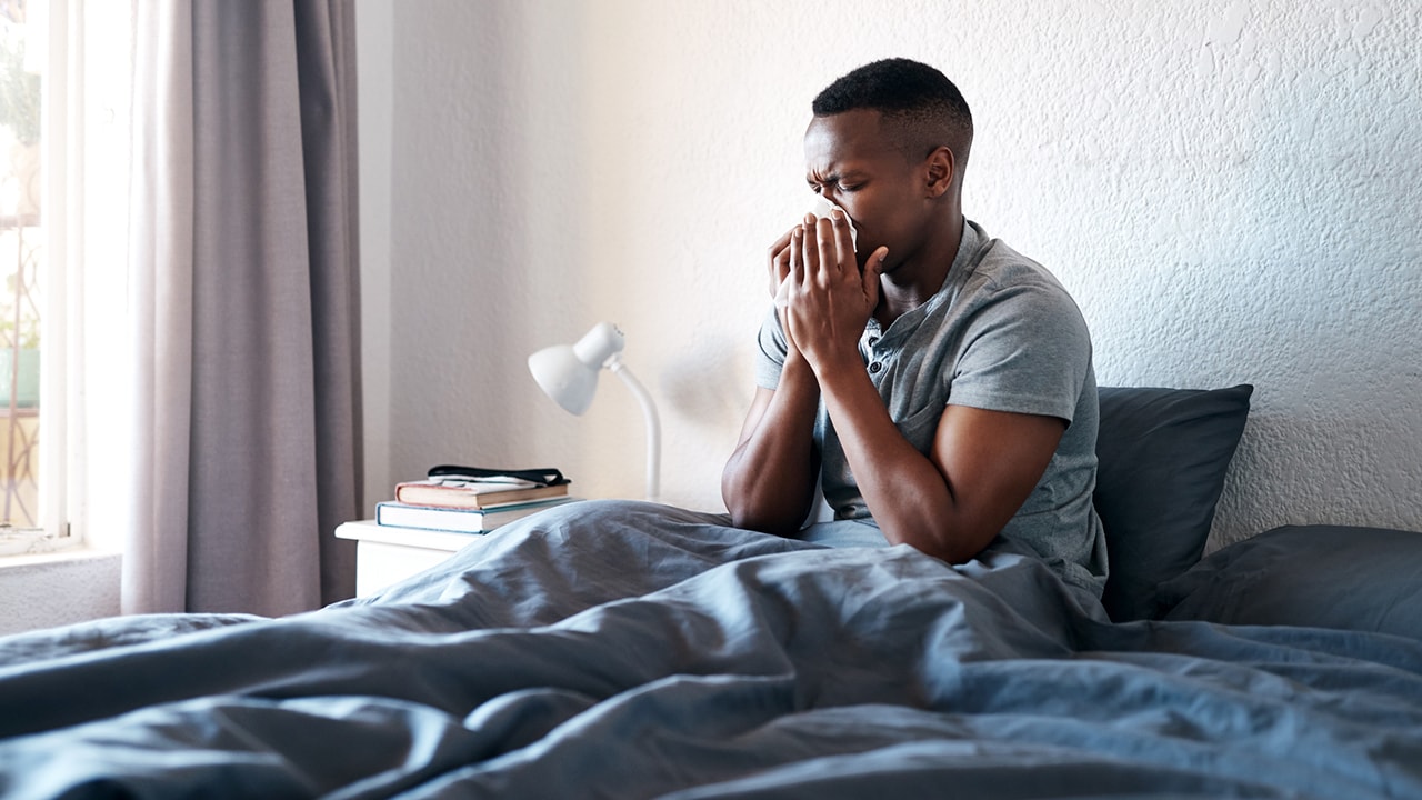 Man sick in bed