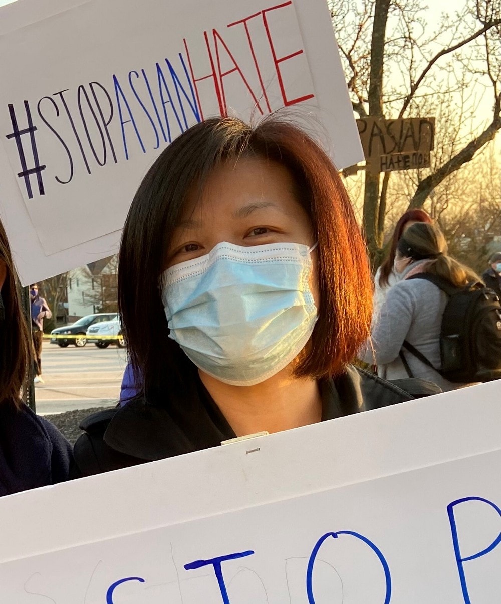 Woman at stop asian hate event